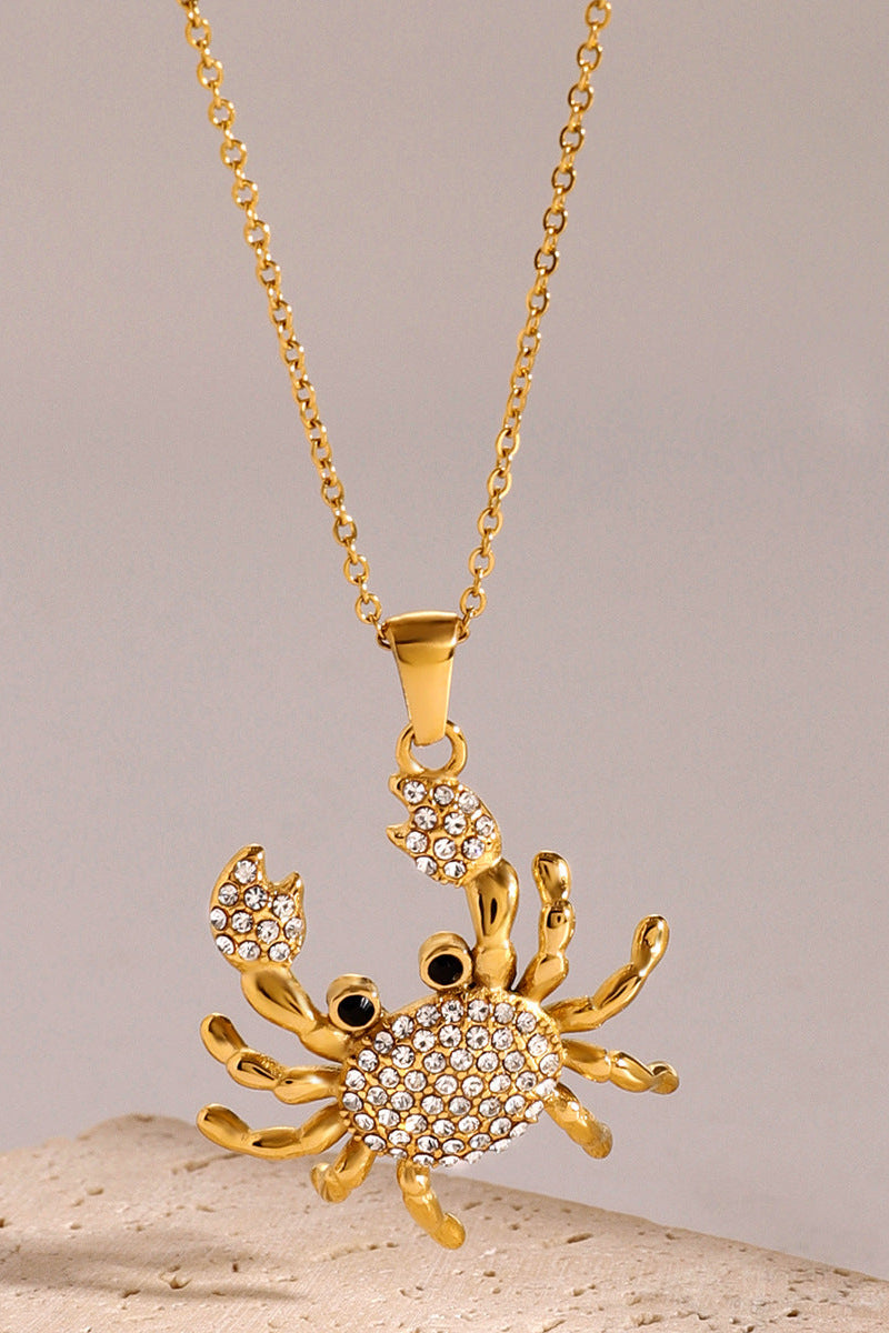 Collier avec pendentif en forme de crabe en or