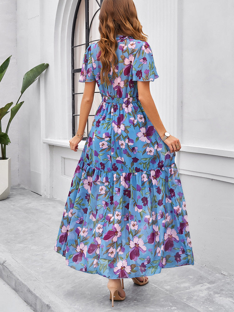 Robe d'été bleue à imprimé floral et col en V 