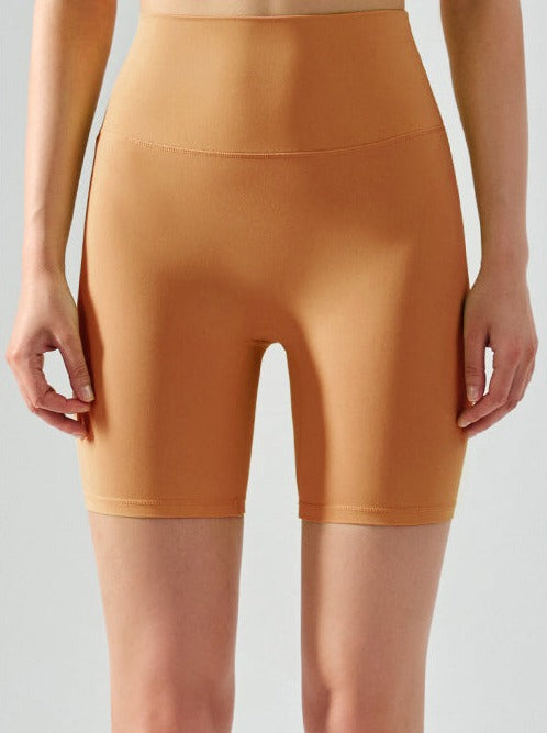 Short de yoga taille haute élastique sans couture de couleur unie 